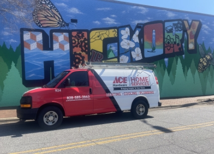 A Ace Hardware Home Services truck parked in front of a Hickory Mural.