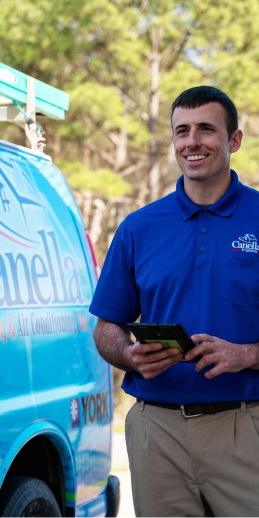 A Canella Tech standing by a truck.