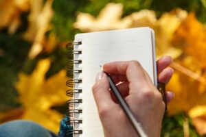 persons-hand-writing-checklist